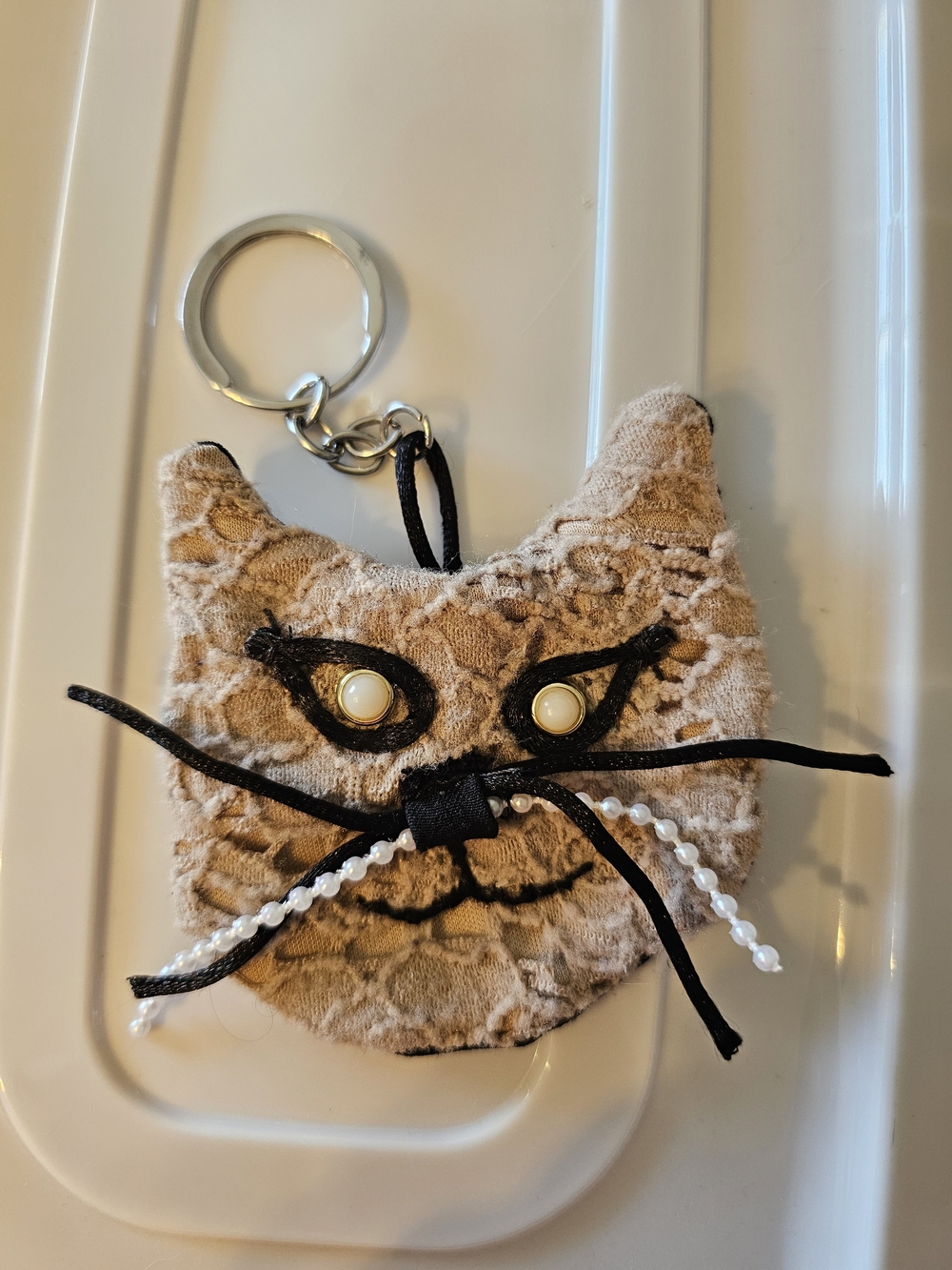Coriander & Cumin Beige Lace &Black Cat Keychain with Pearl Whiskers